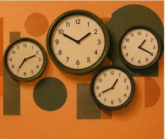 Four clocks on an orange wall each showing a different time, flat graphic illustration style.